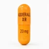 Orange Adderall XR 20 mg capsule for ADHD treatment. Buy adderall online from authorised UK suppliers.